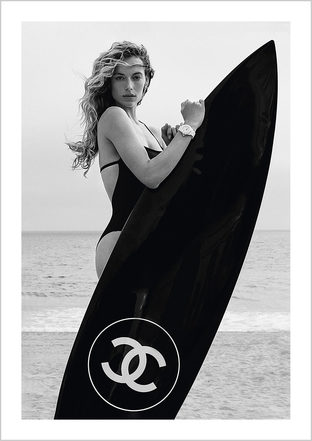 Chanel Girl holding a Black Surfboard Poster