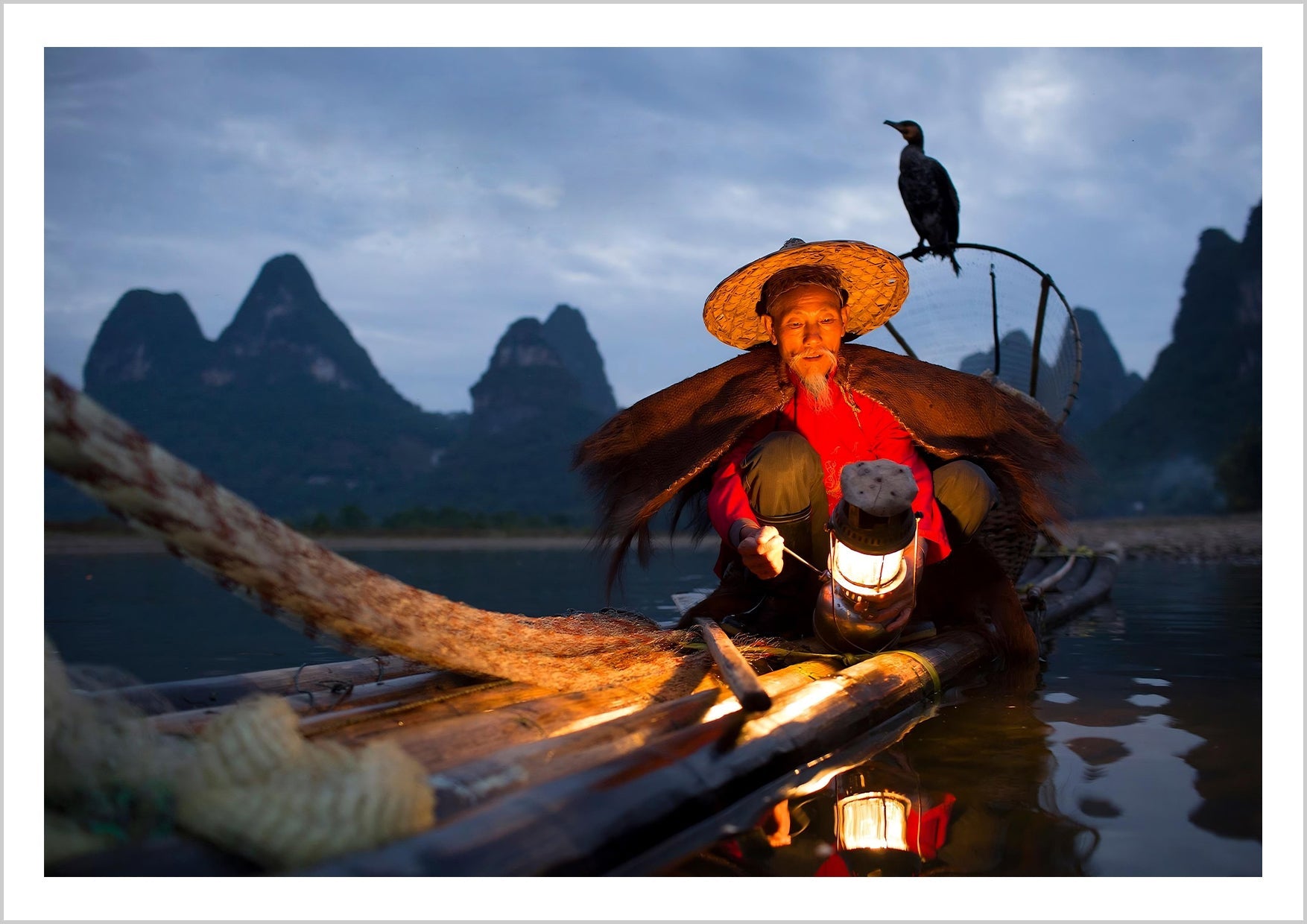 A captivating moment of cormorant fishing on the Li River, where tradition meets nature in perfect harmony.