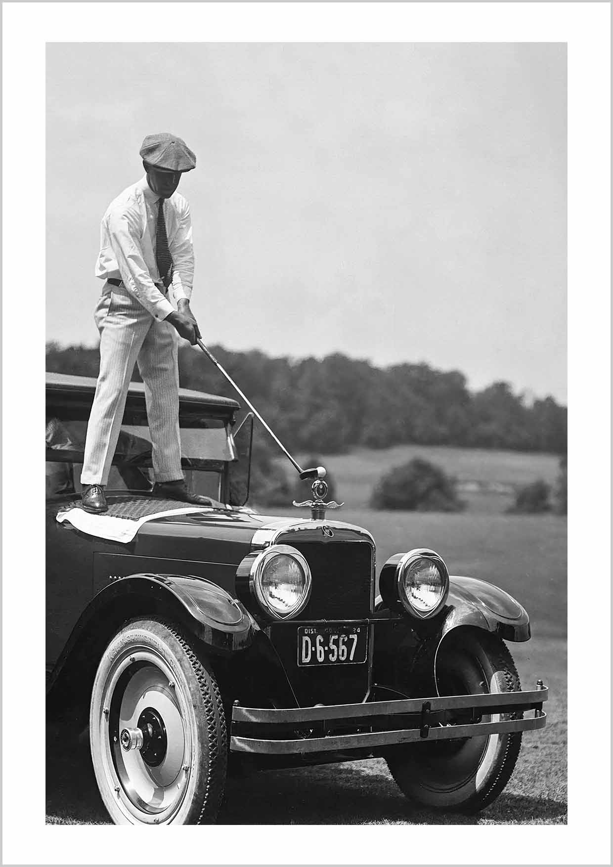 Golfing on top of a car, vintage historic photography 1920s.