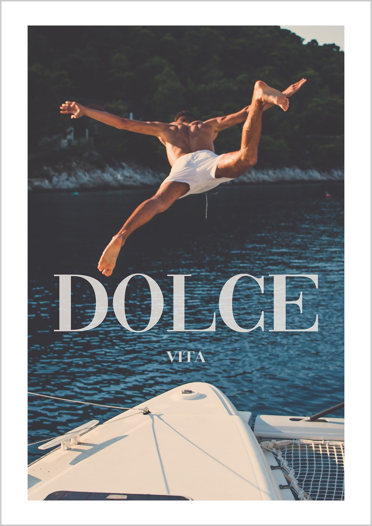 Vintage photography of a man jumping into the sea from a white yacht.