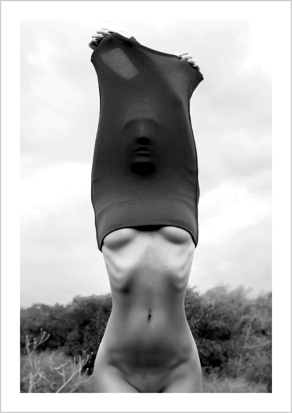 black and white photography Poster of a woman undressing her t-shirt