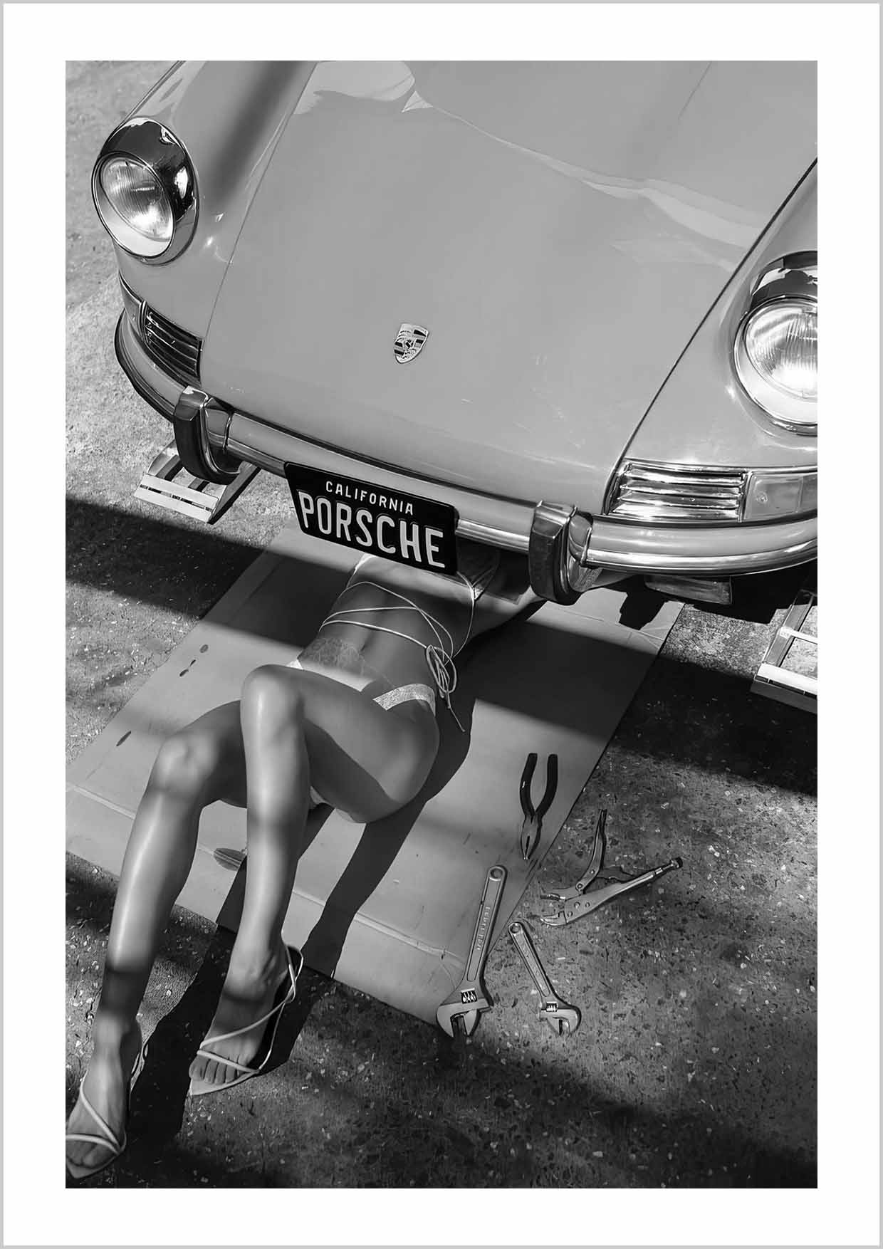 A hotshot photography print of sexy girl under vintage Porsche 911 California.