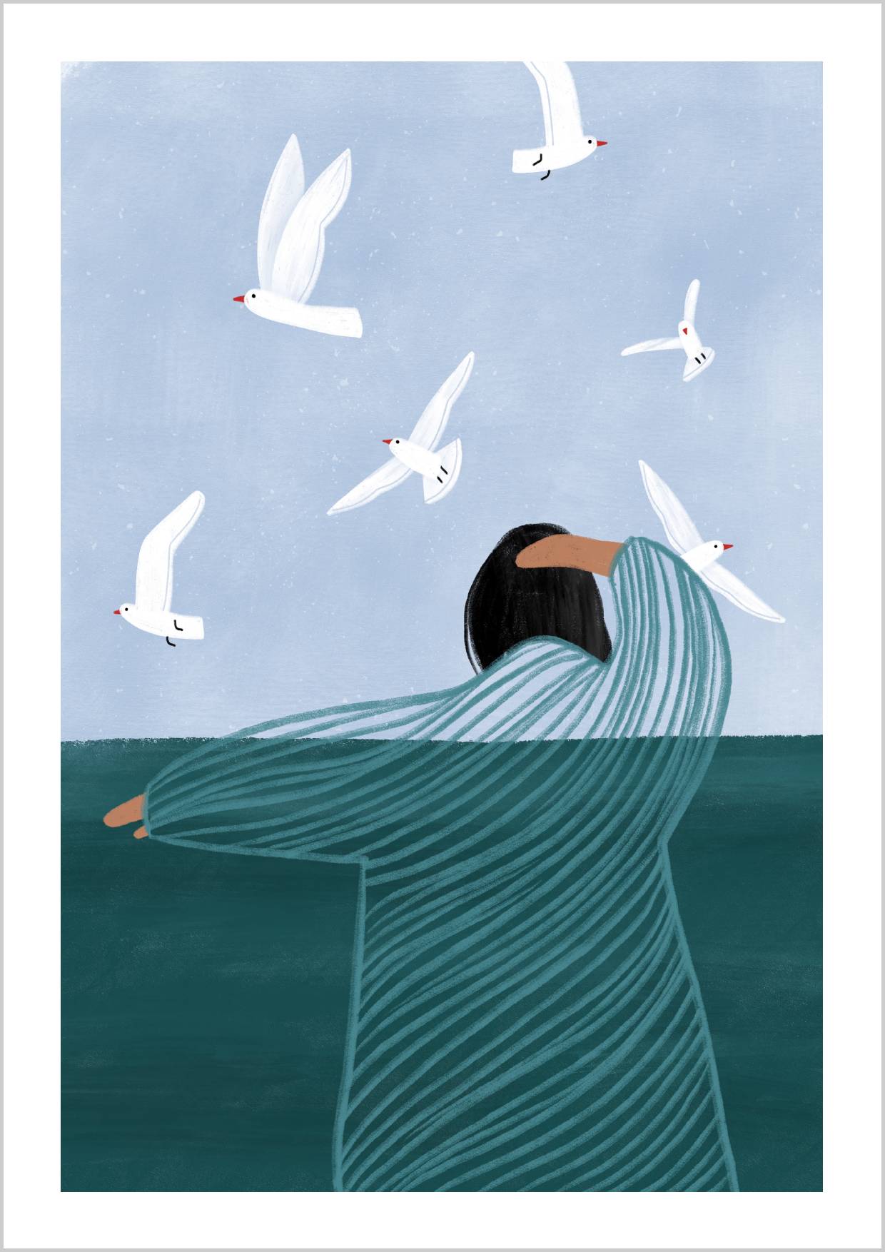 A woman stands at the water's edge, surrounded by seagulls against a soft blue sky. – Arteve Gallery