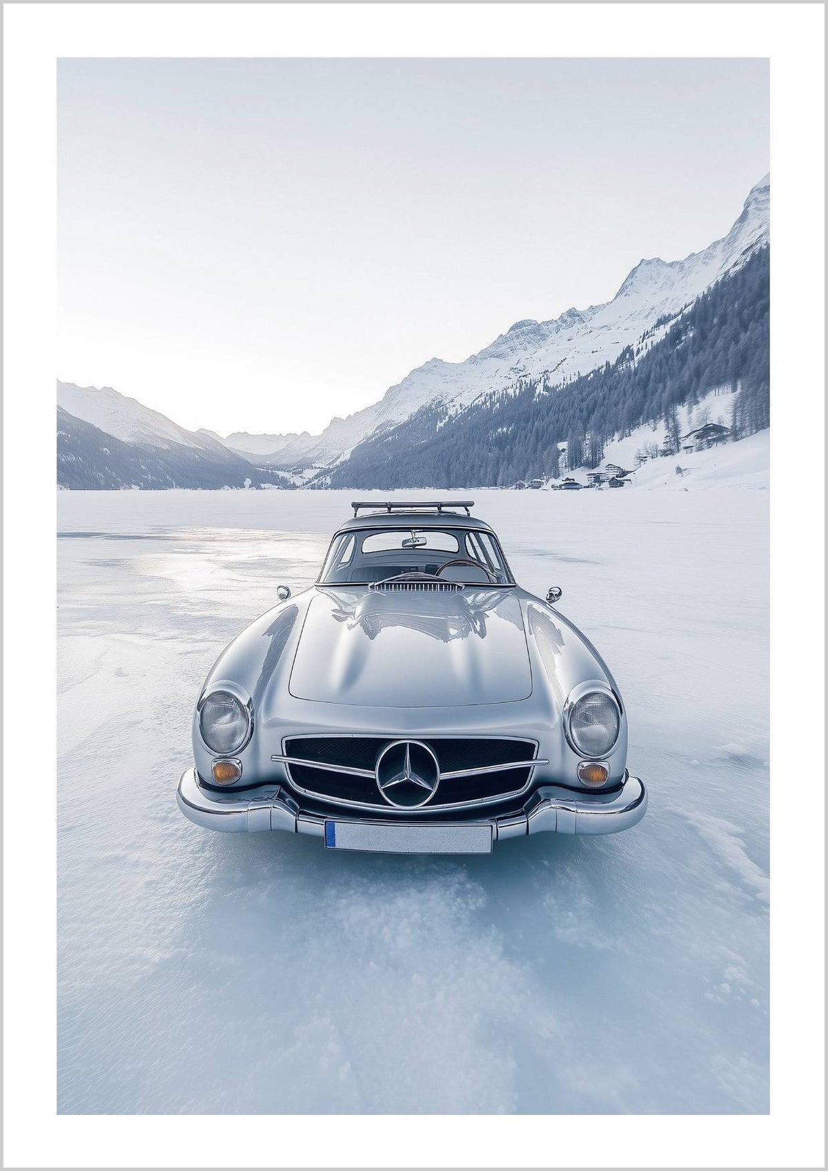 A vintage silver car is parked on a frozen lake, surrounded by snow-covered mountains, under a pale sky. – Arteve Gallery