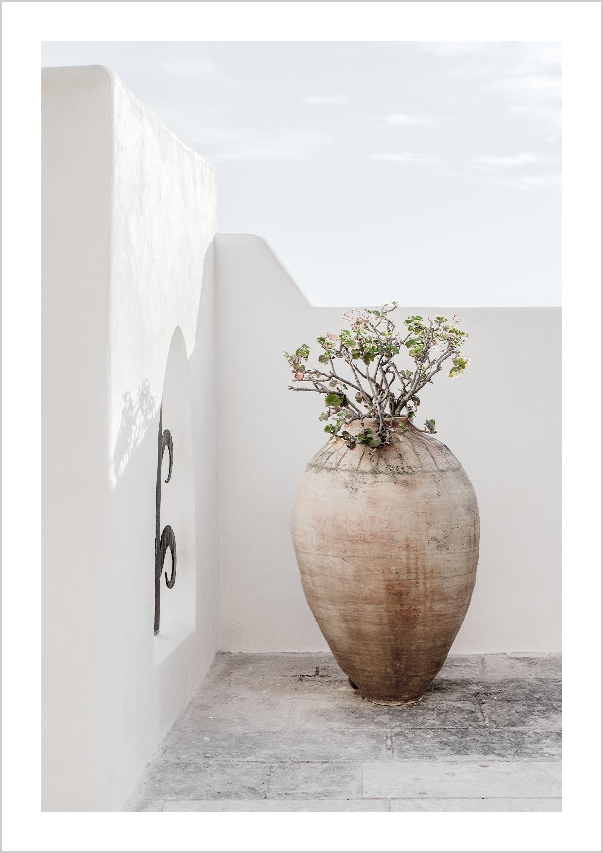 Poster in muted, balanced colors with a photograph of a large pot of flowers