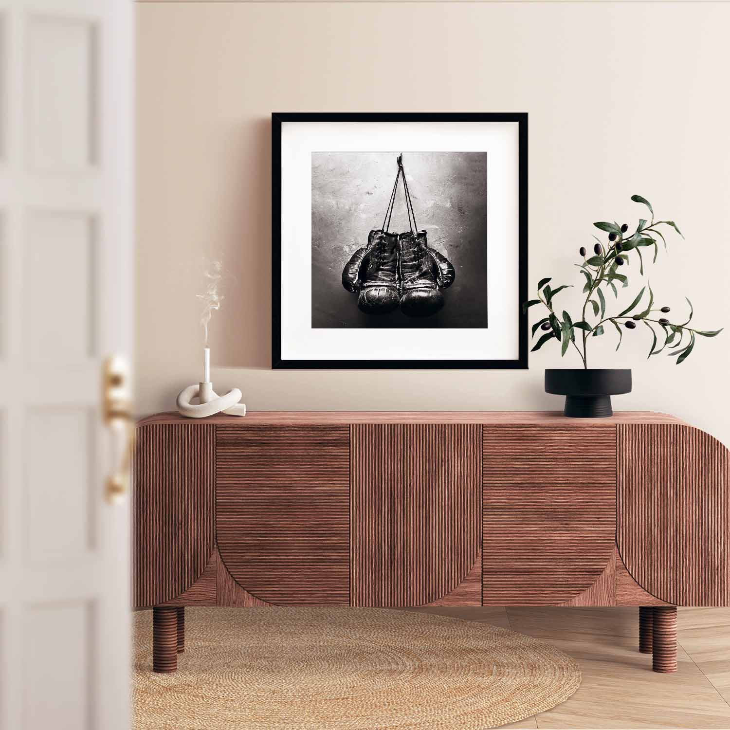 Black and white poster of an old boxing gloves.
