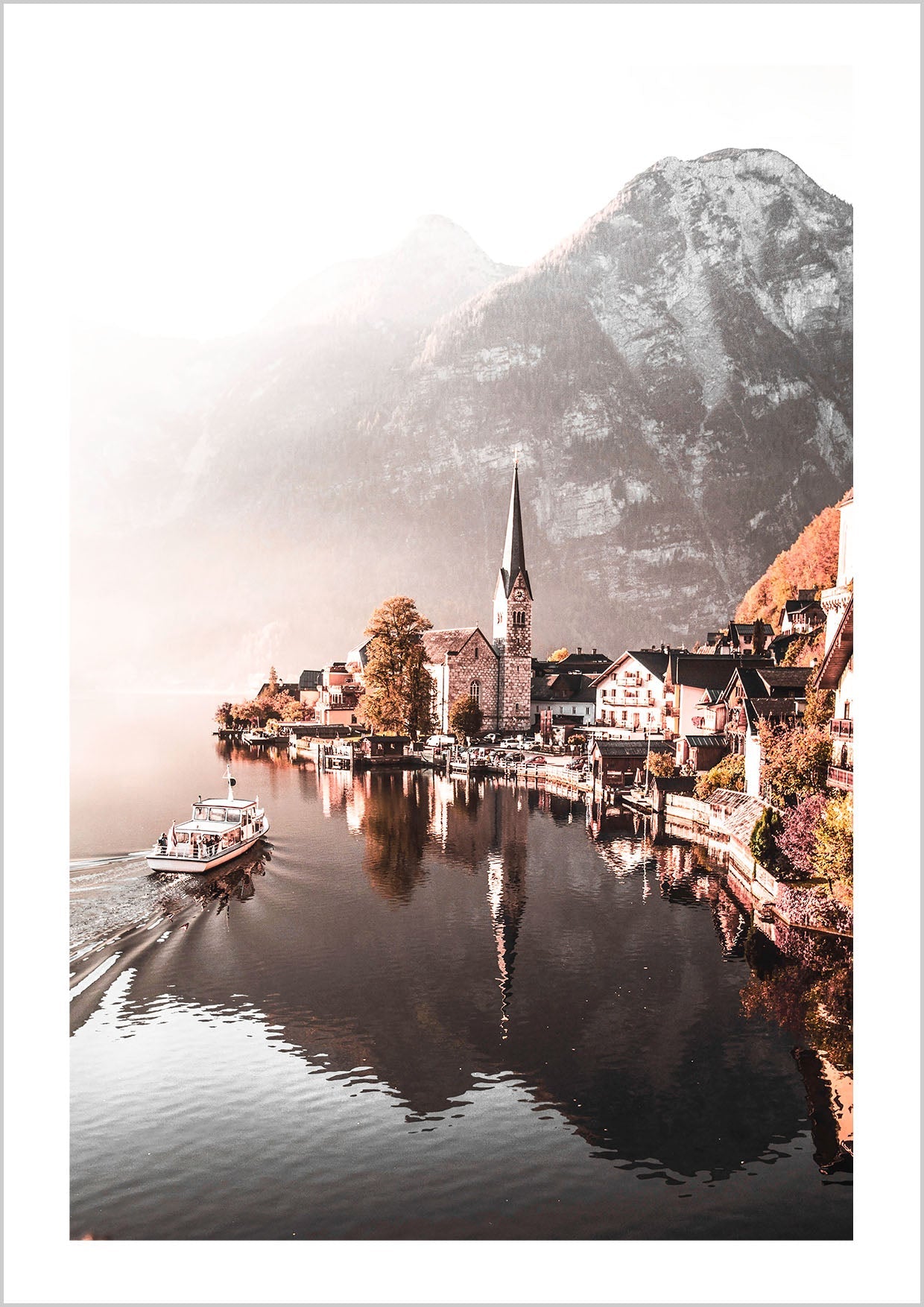 Photography of Hallstatt Town, Styria, Austria. With snow-capped mountains in the background. A boat is arriving at the village