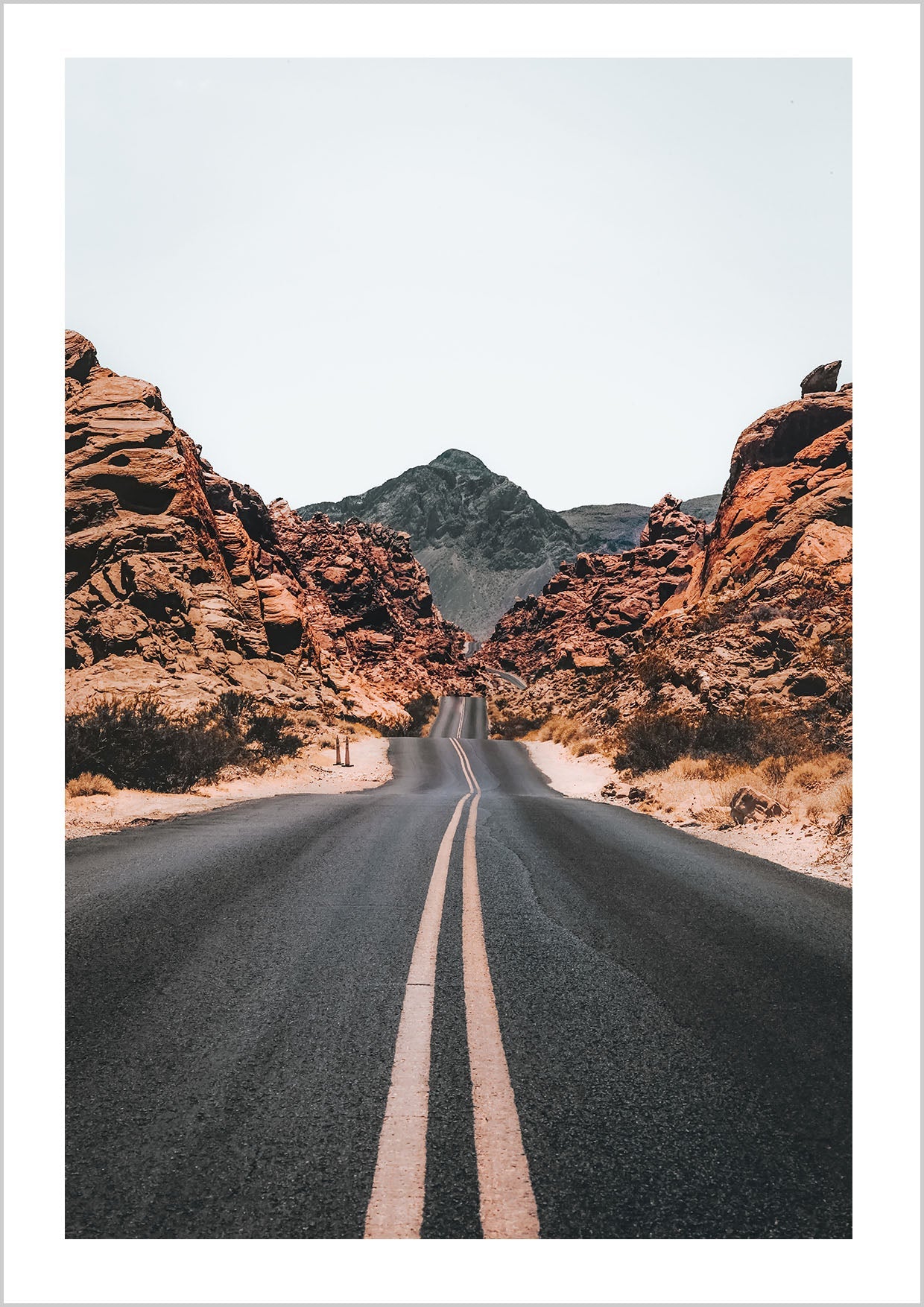 Photograph of a road through mountains in autumn