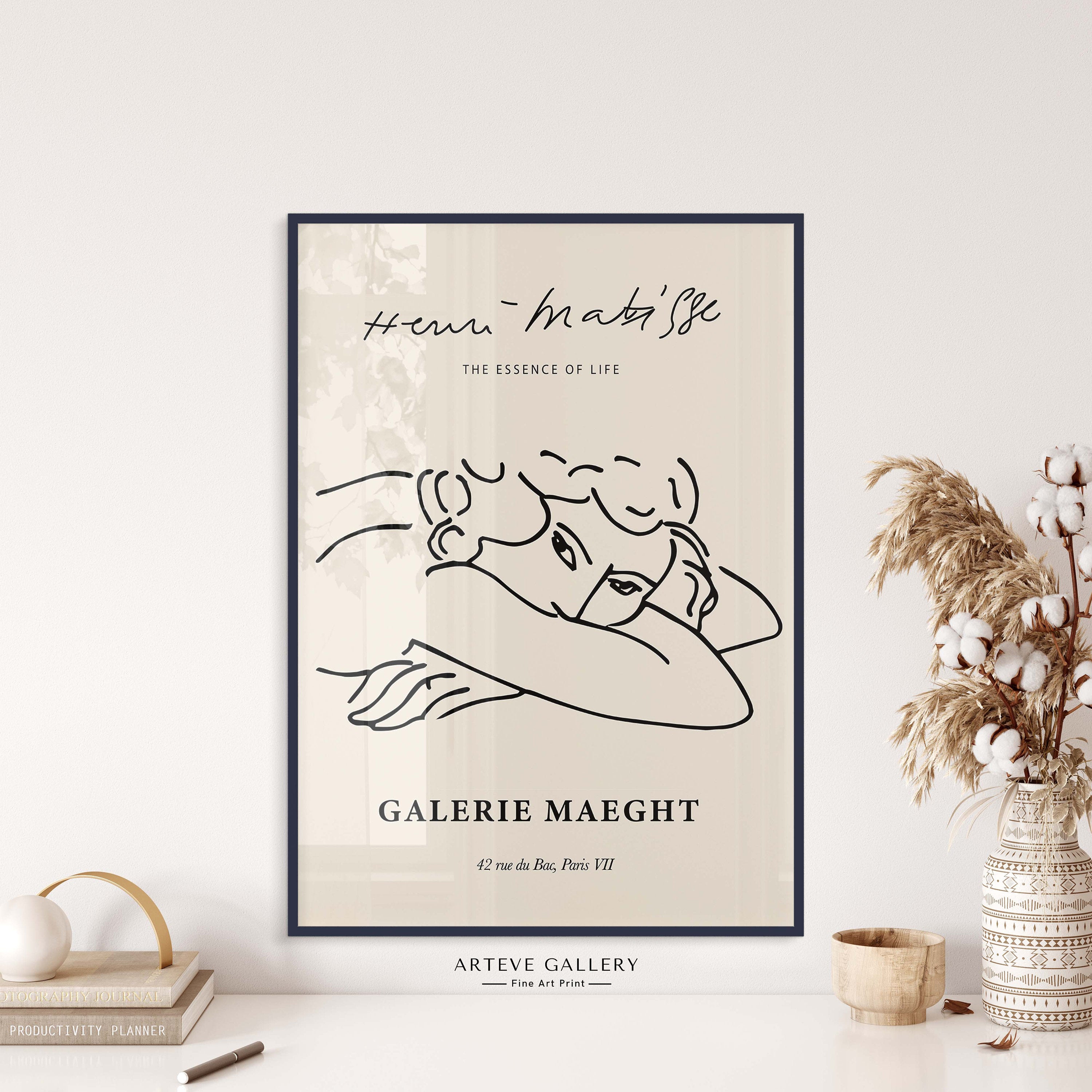 Henri Matisse’s inspired, simple line art of a resting woman on a beige background