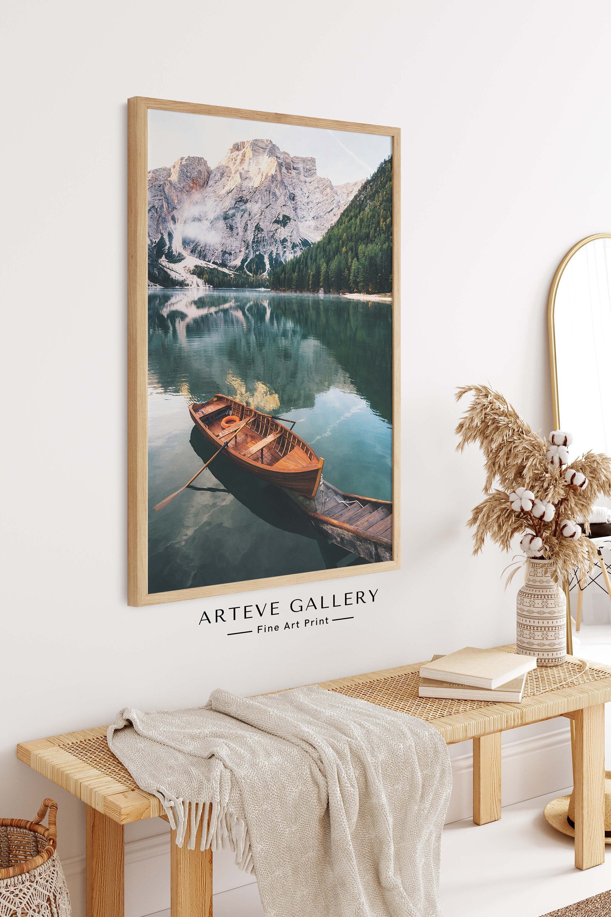 Nature poster with a photographic motif of a red canoe resting on a picturesque wooden pier on a quiet lake. On the side of the clear-blue lake, tall, ice-clad mountains are towering which is reflected beautifully on the still water surface.