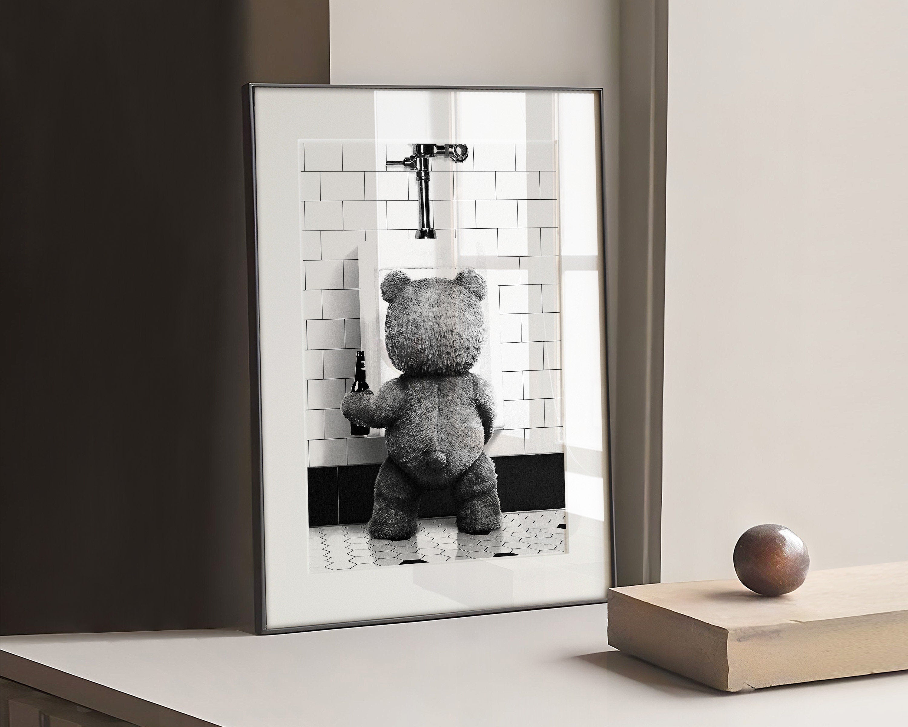 Photograph of Ted Teddy bear holding a drink and doing his toilet
Available in square and large XL poster Poster.