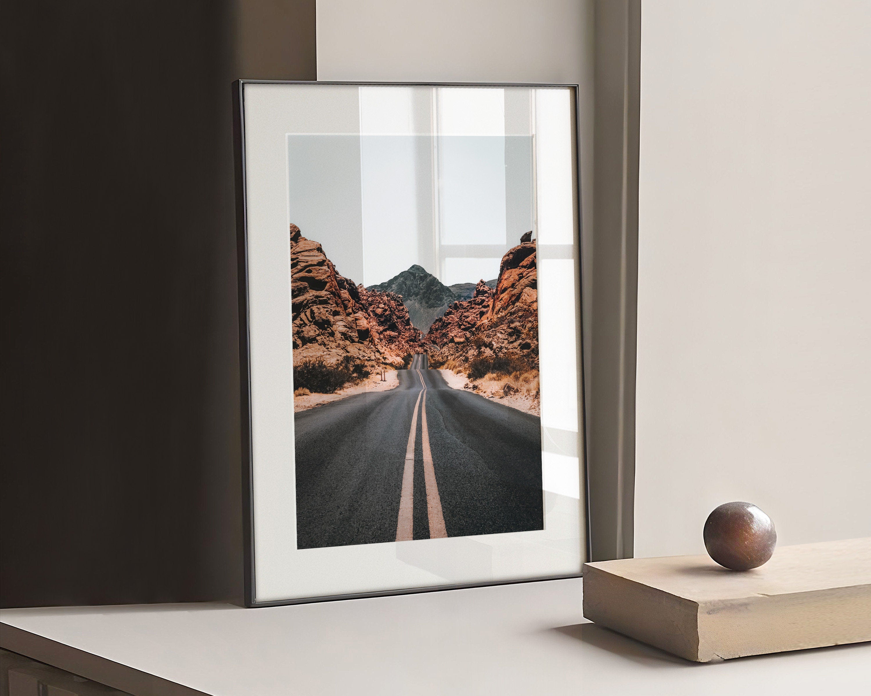 Photograph of a road through mountains in autumn