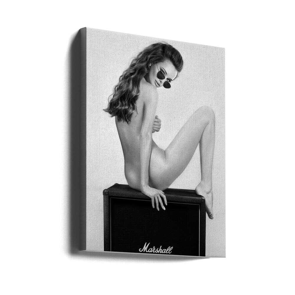 Perched on a Marshall amp with nothing but shades and attitude. This black-and-white artwork turns raw rock’n’roll energy into wall art — cheeky, stylish, and unapologetically bold.
Artist: David Drake
