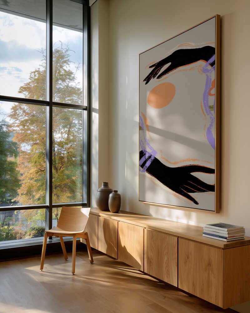 Two open hands frame a glowing orange sun, sleeves alive with floral tones of purple, green, and amber. A simple, uplifting composition that feels warm and contemplative, easy to place in living rooms or calm corners. Artist: Arty Guava
