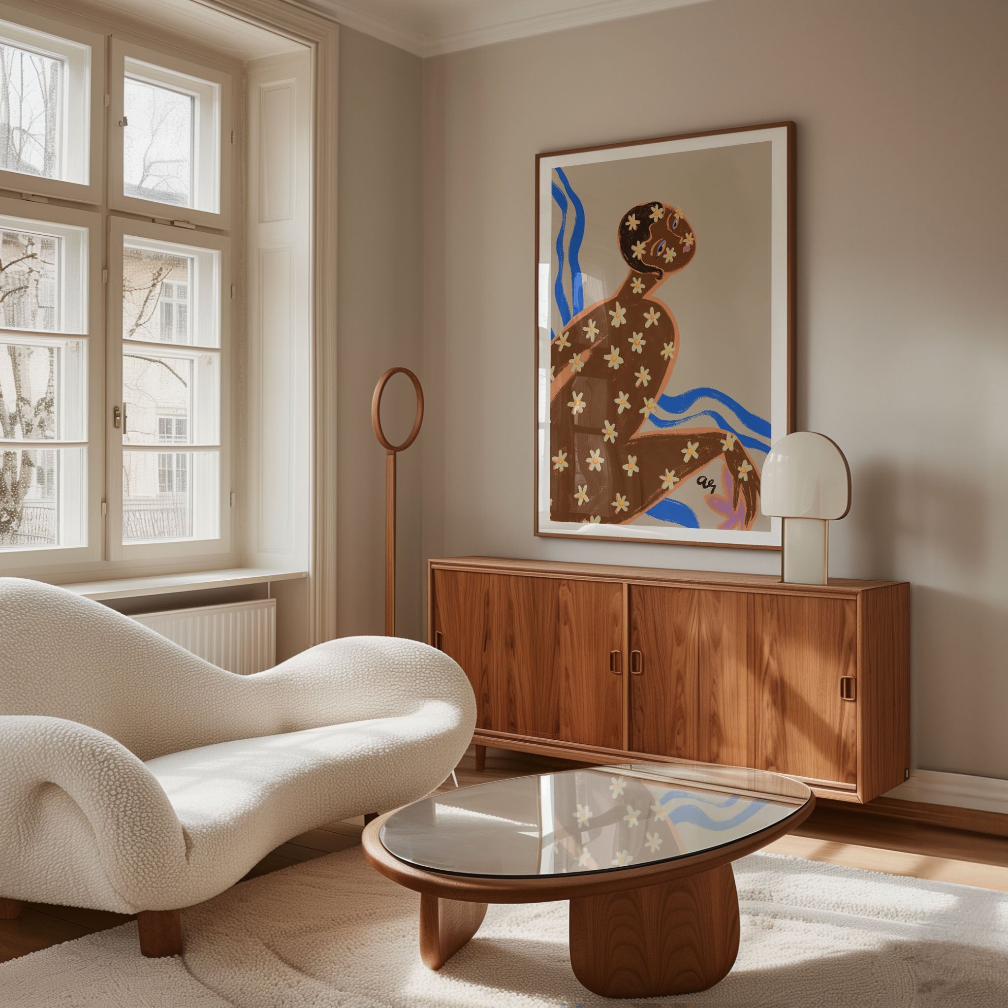 A reclining figure covered in daisy blossoms sits against flowing blue waves. The design blends natural motifs with soft, grounded tones, bringing a sense of harmony and renewal. Ideal for brightening bedrooms, bathrooms, or calming interiors.
Artist: Arty Guava
