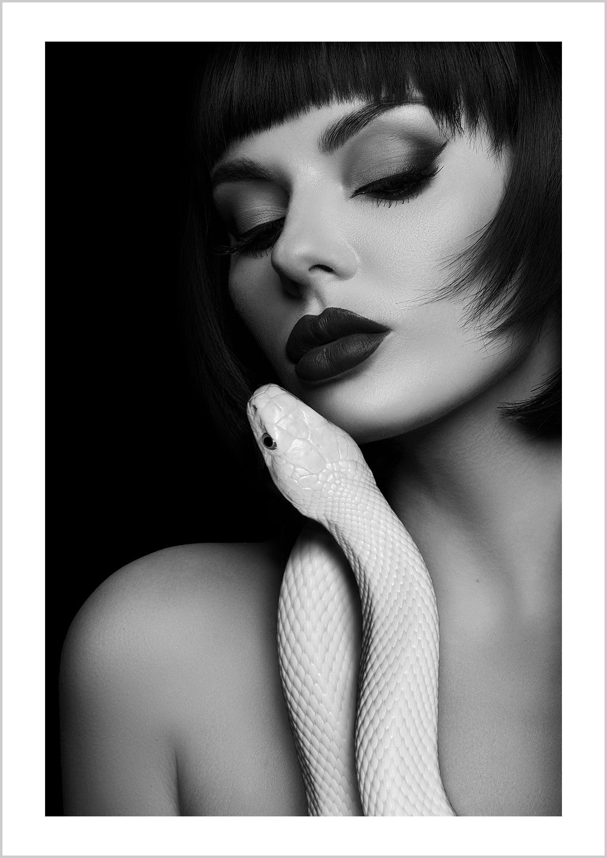 A woman and a snake — beauty wrapped in tension. Forbidden Embrace is minimal, provocative, and impossible to ignore.