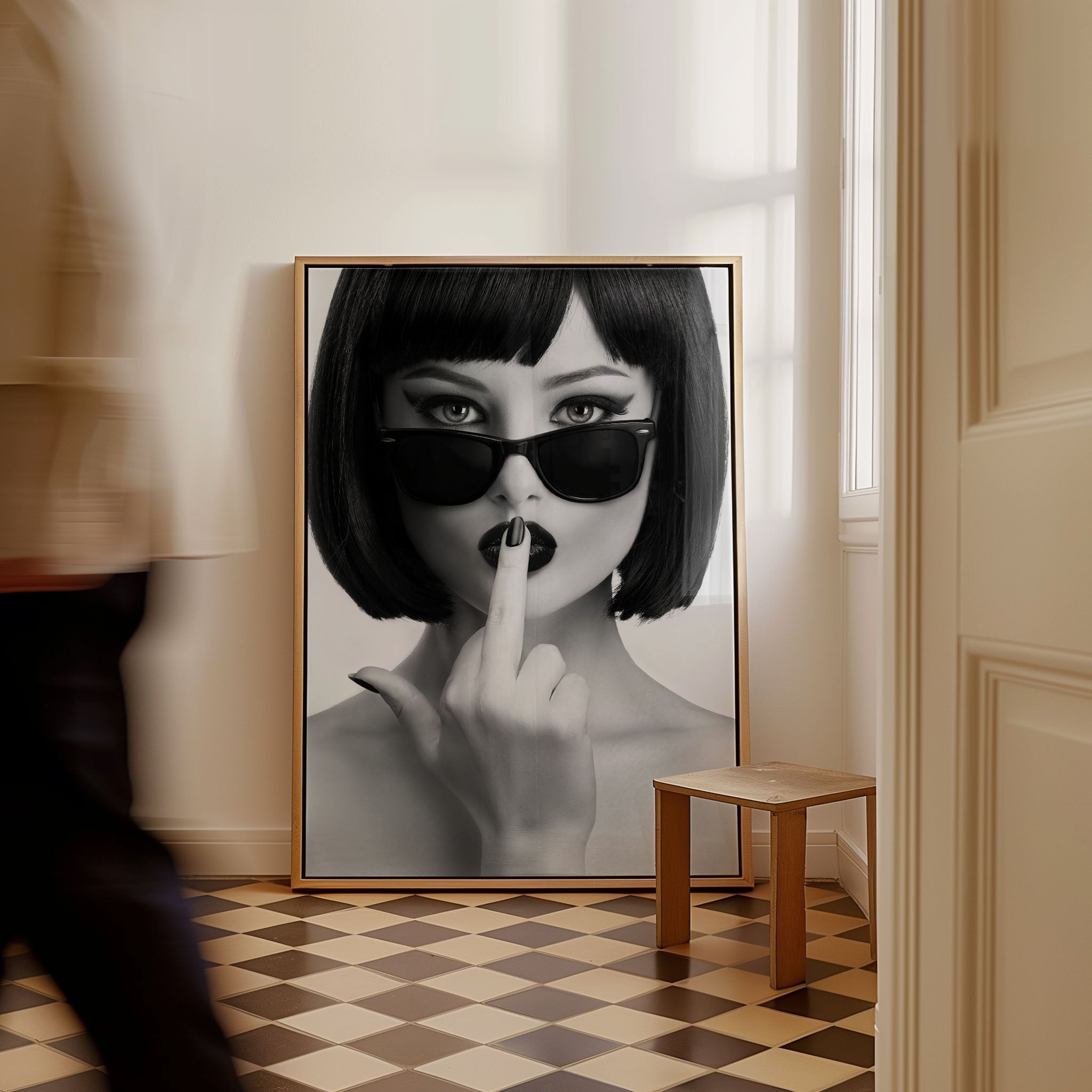 A femme fatale in dark sunglasses, lips parted, flipping the rules with a daring gesture. Black-and-white attitude, bold and unapologetic — this print is made to turn heads.
Artist: David Drake