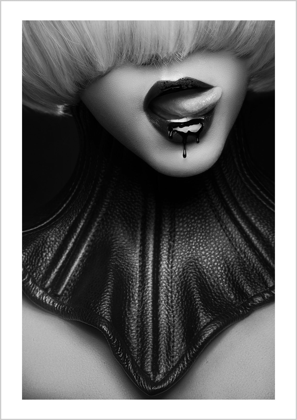 Dark, sensual and a little dangerous. Madame Noire focuses on lips with a piercing, captured in moody black and white. A statement piece for lovers of bold, rebellious art.