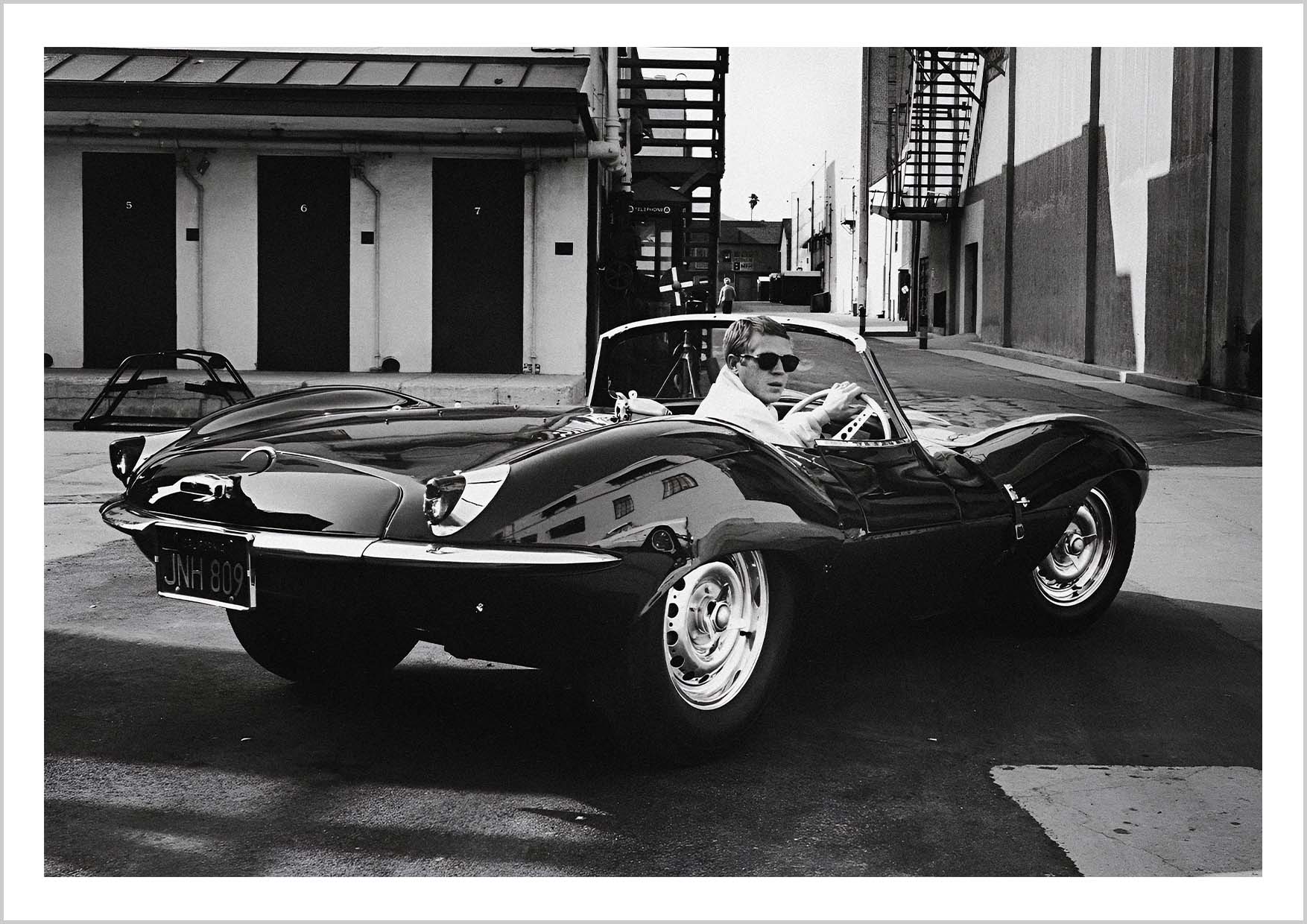 Steve McQueen driving his Jaguar