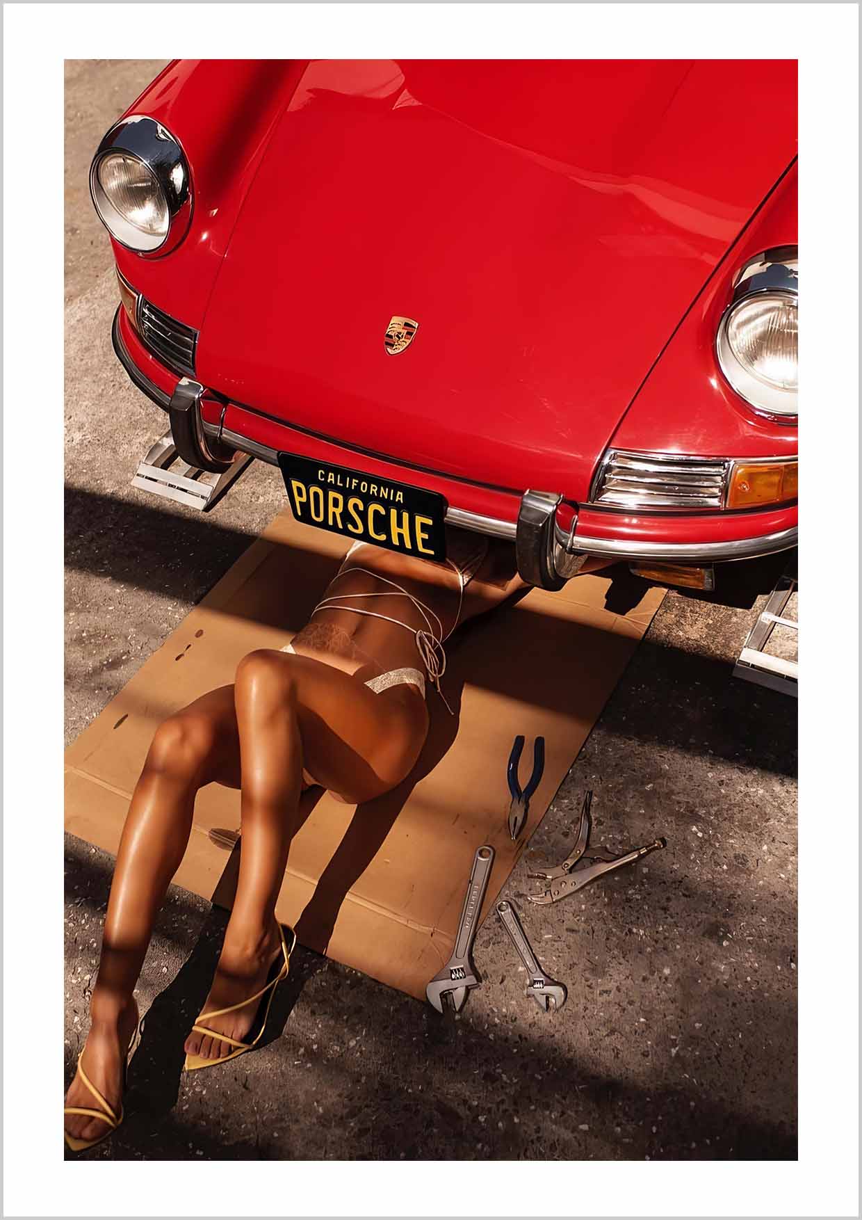 A hotshot photography print of sexy girl under vintage Porsche 911 California.