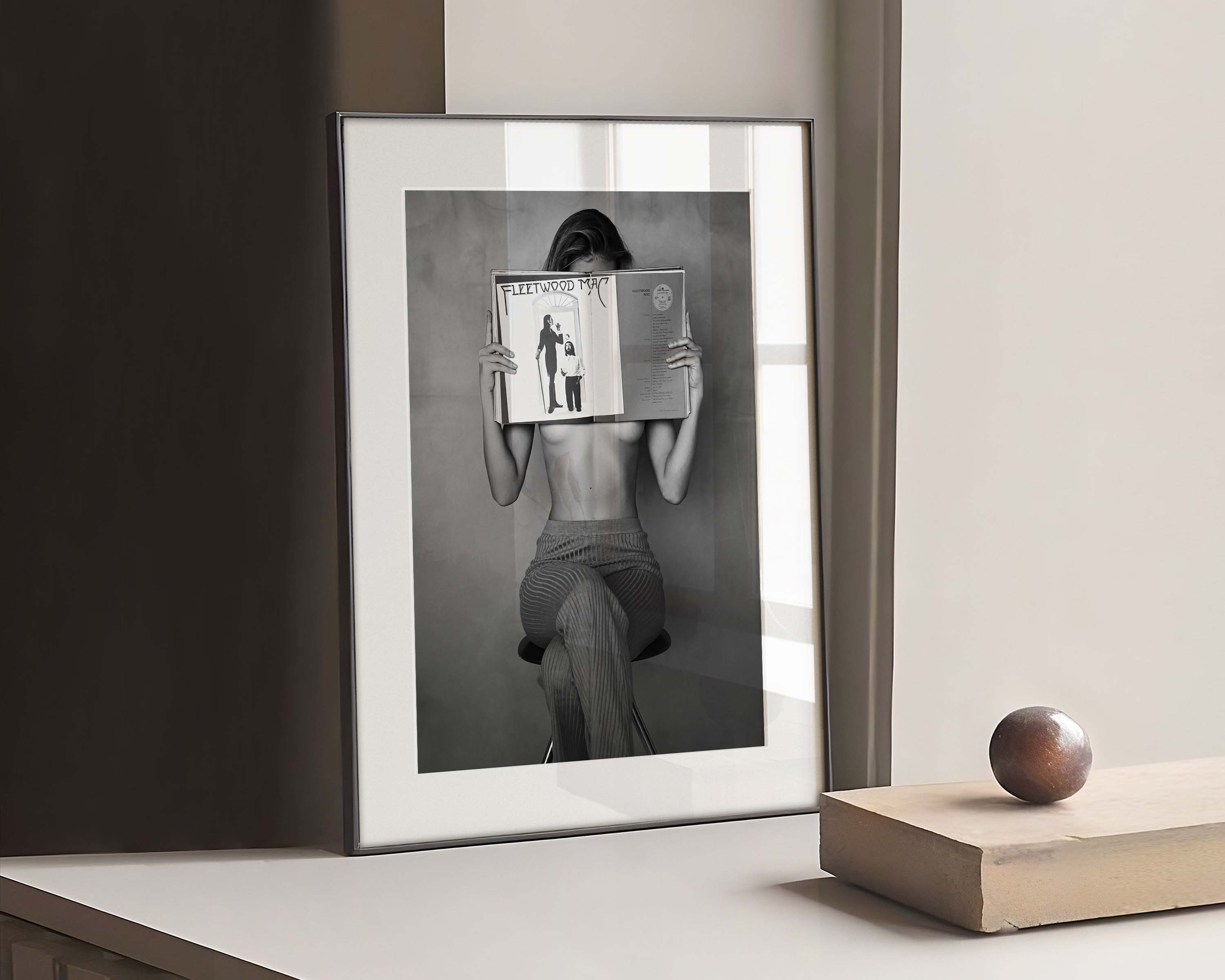 Black and white photography Poster of a topless woman reading Fleetwood Newspaper.