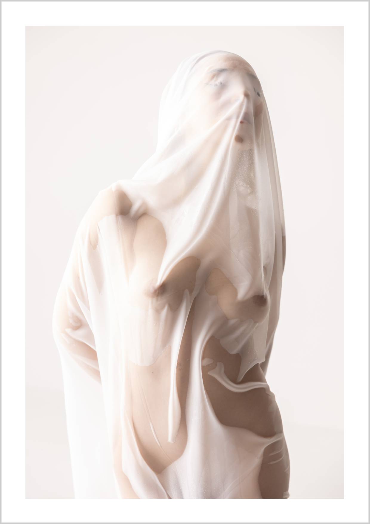 A figure partially obscured by a sheer, flowing fabric, revealing hints of the body beneath. – Arteve Gallery