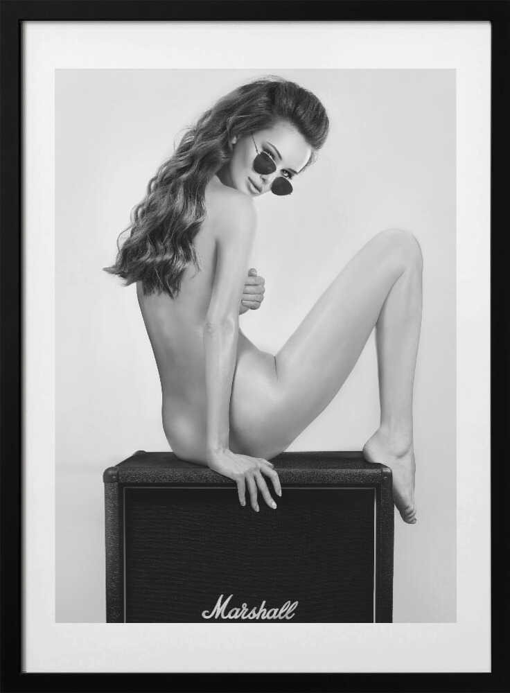 Perched on a Marshall amp with nothing but shades and attitude. This black-and-white artwork turns raw rock’n’roll energy into wall art — cheeky, stylish, and unapologetically bold.
Artist: David Drake