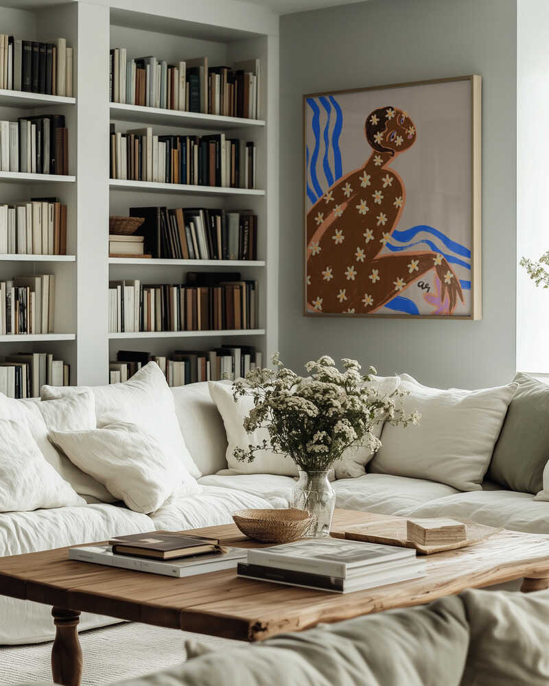 A reclining figure covered in daisy blossoms sits against flowing blue waves. The design blends natural motifs with soft, grounded tones, bringing a sense of harmony and renewal. Ideal for brightening bedrooms, bathrooms, or calming interiors.
Artist: Arty Guava
