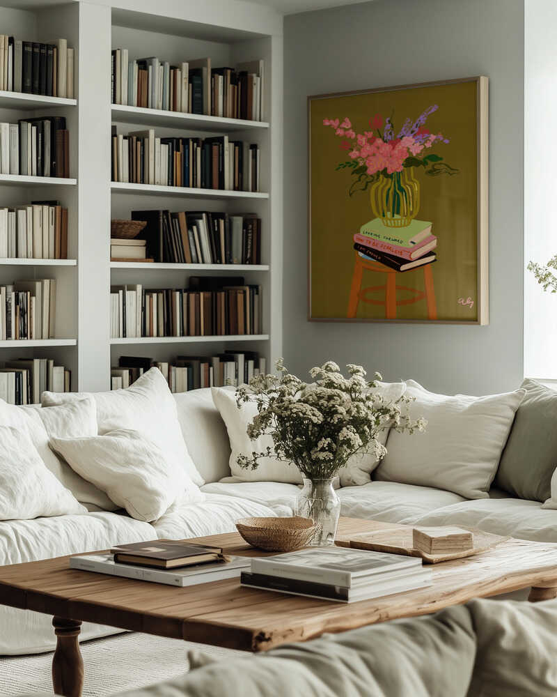A lush bouquet of pink and purple blooms arranged in a green vase, resting atop a stack of books. With its warm olive background, this still life carries both elegance and homely charm — perfect for dining areas, kitchens, or cozy living spaces.
Artist: Arty Guava