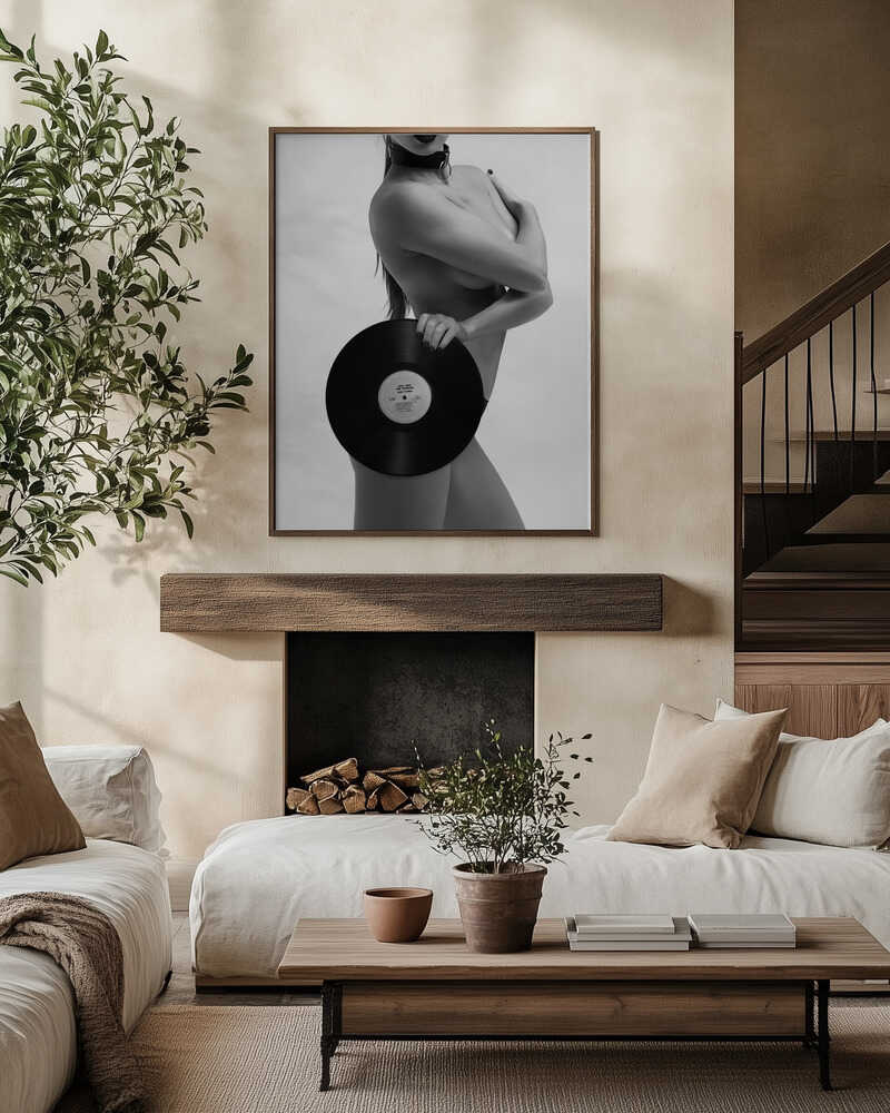 Minimal color, maximum defiance. A striking nude holding a vinyl record, captured in monochrome. Music, rebellion, and sensual confidence collide in this unforgettable artwork.
Artist: David Drake