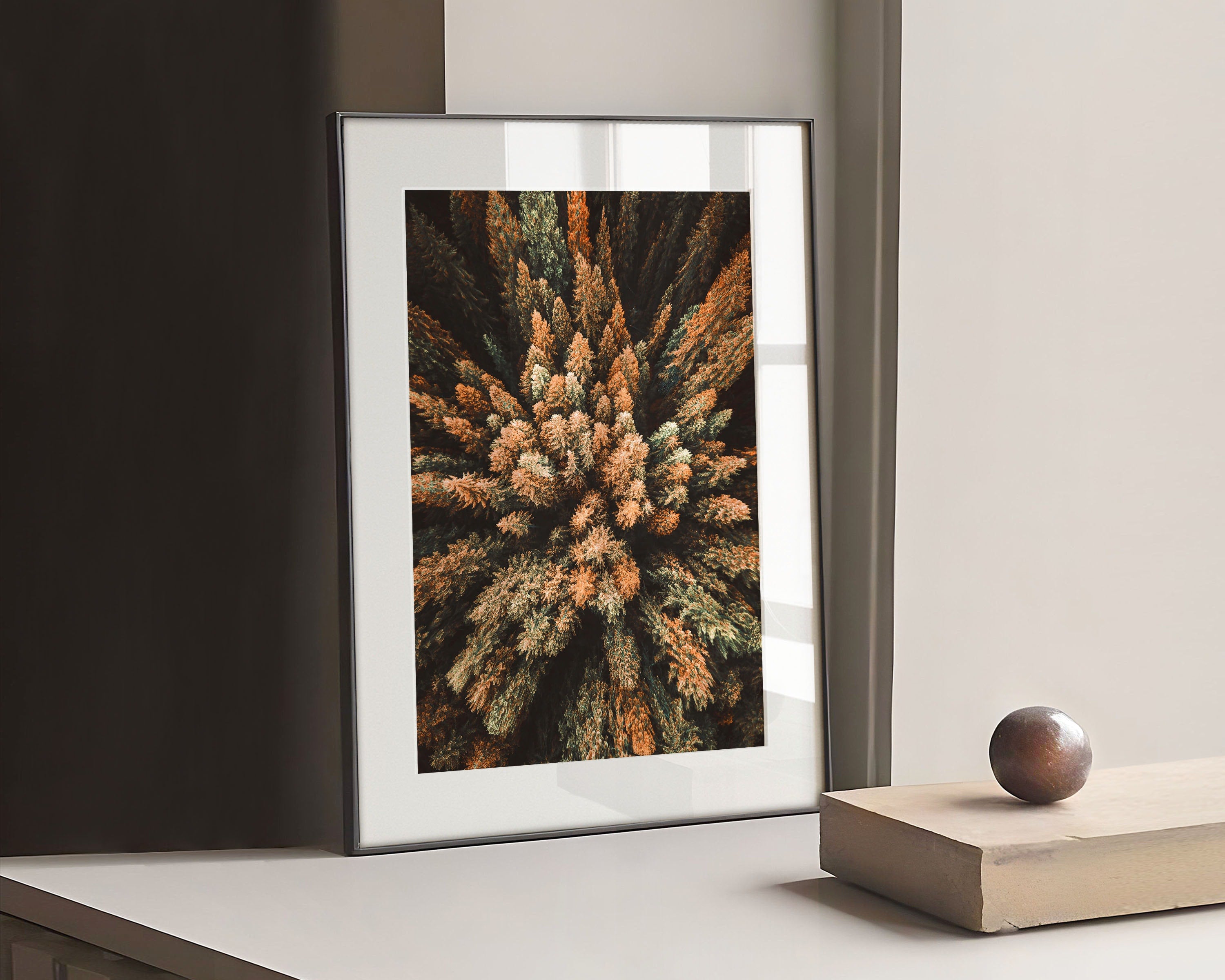 A fascinating nature print of colorful tree tops from above. The photographic print impresses with great fall colors from dark red and gold to dark green, which radiate peace and calmness. Breathe in the fragrant forest air and enjoy fall inside your own four walls!